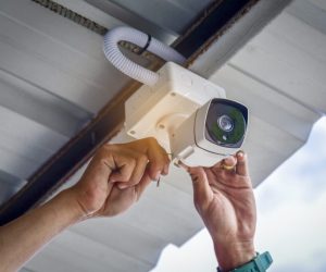 Technician installing CCTV camera system for security area