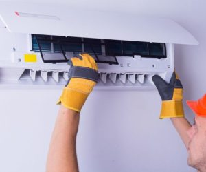 Placing back clean filter into air conditioner
